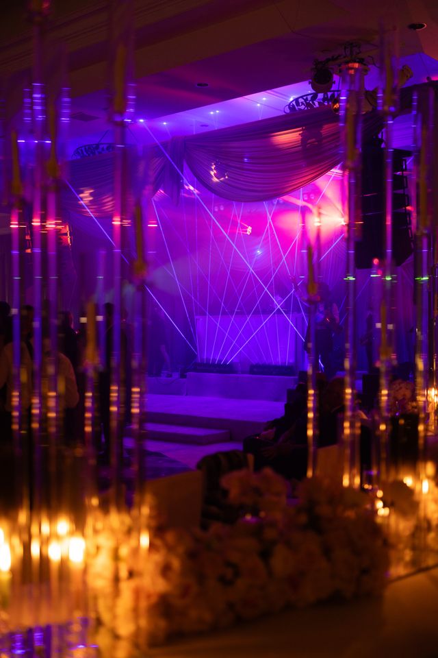 Featured photo from See This Romantic Monarch Beach Wedding Illuminated by Candlelit Aisles and Neon-Washed After-Party Lighting