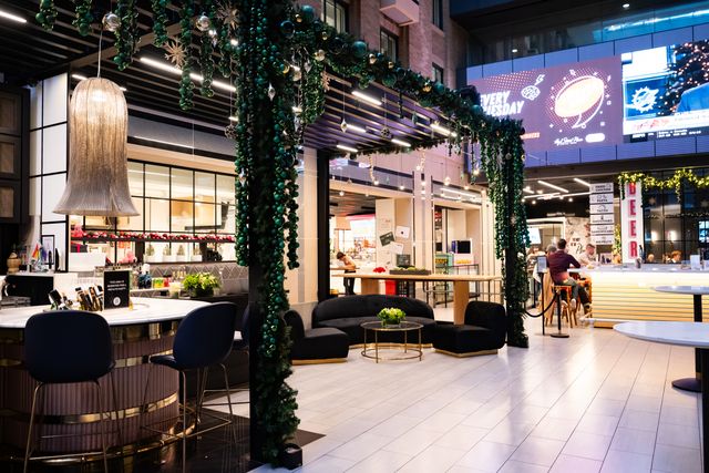 Featured photo from Celebrate This Festive Corporate Gathering Featuring Winter Greenery and Cocktail-Style Seating in Boston