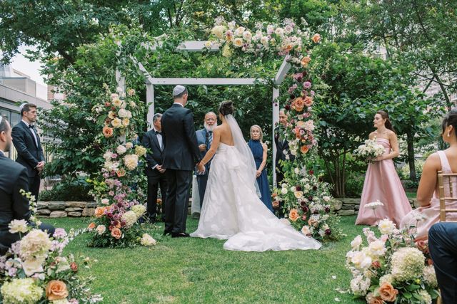 Featured photo from This Garden Terrace Wedding in Boston Was Meant To Be with Soft Candlelight and Layered Summer Florals