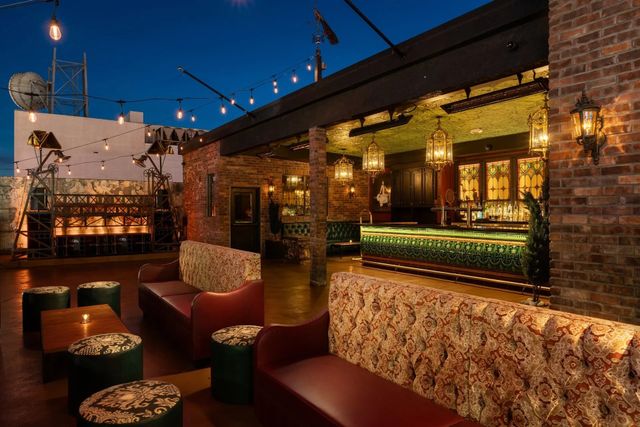 Featured photo from Commonwealth: rooftop bar with stage, plus the Laundry Room speakeasy