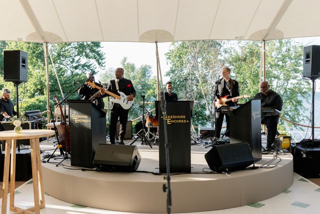 Featured photo from Dance the Night Away at this Spirited Tented Wedding with a Live Band in Chicago
