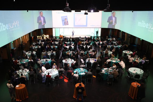 Featured photo from Inside This Large-Scale Summit in Glendale, CO with Wraparound LED Displays and Conference-Style Seating