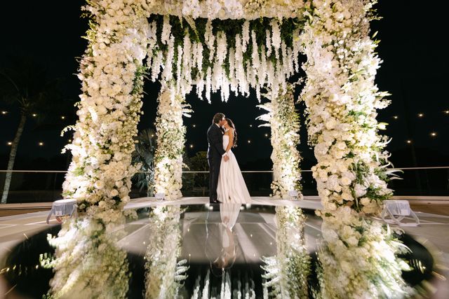 Featured photo from A Classic Wedding at Broken Sound Country Club Featuring a White Floral Chuppah and Elevated Tablescapes