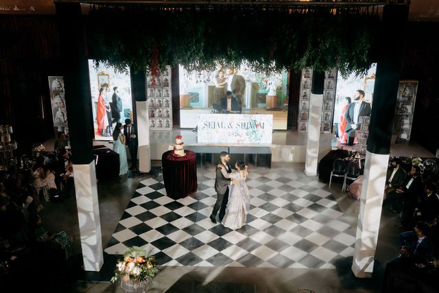 Featured photo from Discover This Dallas Wedding Reception with Floral-Framed Digital Screens and Dramatic Ballroom Lighting