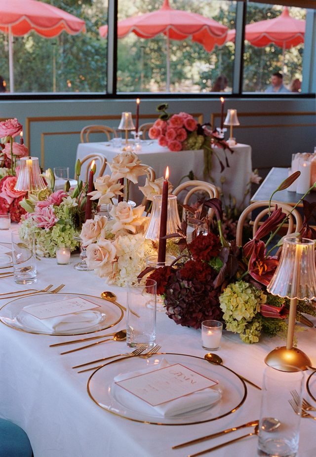 Featured photo from A Modern Maximalist Rooftop Wedding with Outdoor Umbrellas and Skyline Views