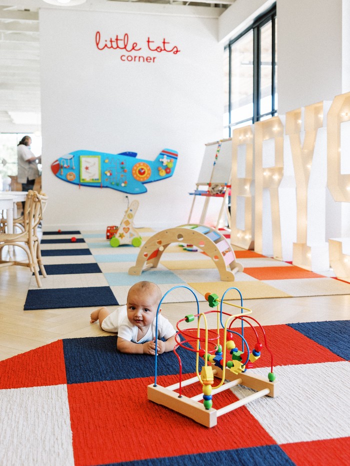 Baby exploring the Little Tots Corner at TLPA