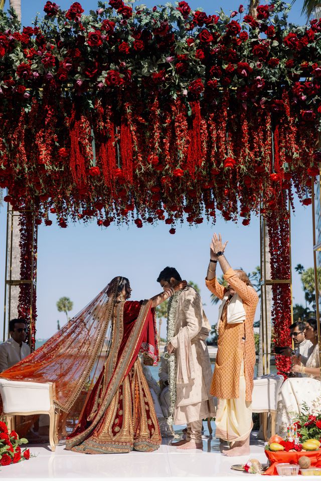 Featured photo from Elegant Hindu Wedding with a Red Rose Mandap in Sarasota