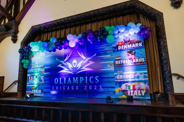 Featured photo from Go for Gold at this Dynamic Bar Mitzvah at Michigan Shores Country Club with Bold Lighting and Olympic Flair