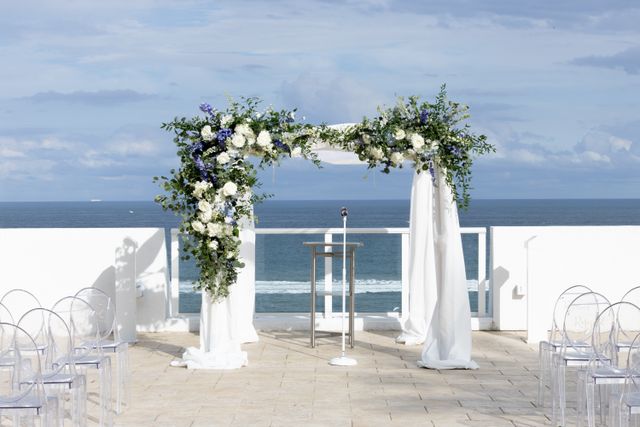 Featured photo from Inside This Oceanfront Wedding with Blue and White Floral Installations at The Conrad